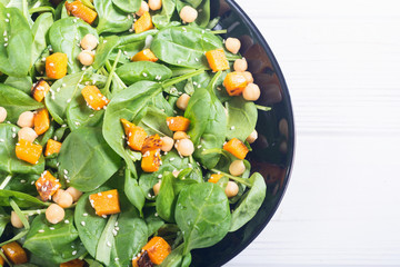 autumn salad with pumpkin , spinach , chickpea and sesame