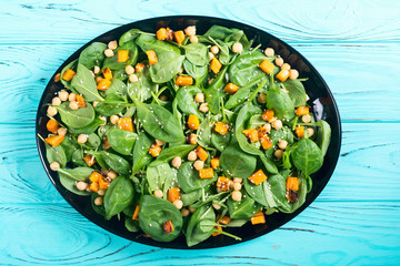 autumn salad with pumpkin , spinach , chickpea and sesame