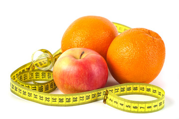 Apples and orange with measure tape on white background, healthy diet