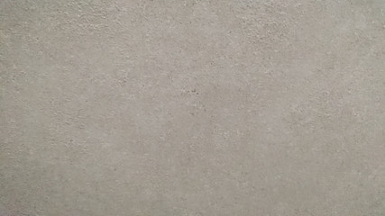 The background of a gray wall. Selective focus.