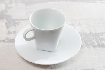 white cup on ceramic background