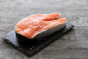 raw salmon on ceramic background