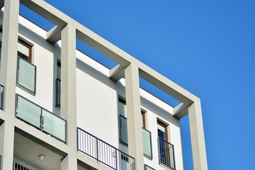 Modern apartment buildings on a sunny day with a blue sky. Facade of a modern apartment building