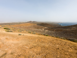 Spectacular coastal view of Playa Amarilla with desert landscape.