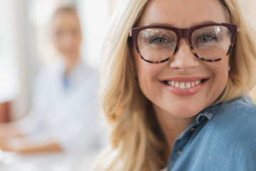 Joyful blonde attractive woman expressing true positivity