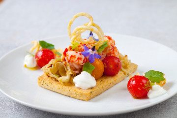 Thyme tart with crayfish, goat cheese mousse and tomato