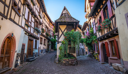 Fototapeta na wymiar Colorful medieval half timbered buildings in Alsatian village France.