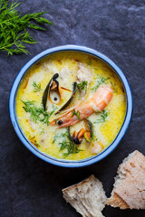 Scandinavian creamy fish soup with halibut, prawns and mussels
