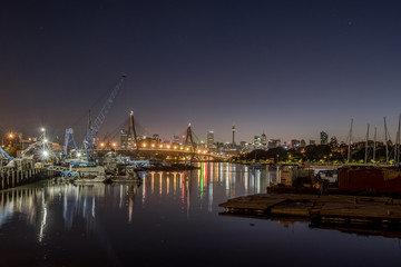 Fototapeta na wymiar Sydney city and NZAC Bridge at dawn