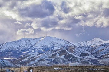 inter Panorama of Oquirrh Mountain range snow capped, which includes The Bingham Canyon Mine or Kennecott Copper Mine, rumored the largest open pit copper mine in the world in Salt Lake Valley, Utah. 