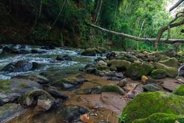 view of a river in the mountains to sunset