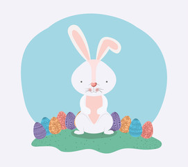 cute rabbit with easter eggs painted in the camp