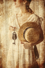 Woman holding old key in a hands