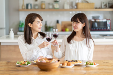 attractive asian women enjoying home party