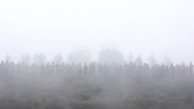 Captured by enemy concept. Military silhouettes and crowd on war fog sky background. World War Soldiers and armored vehicles movement while scared people watching. Artwork decoration. Selective focus