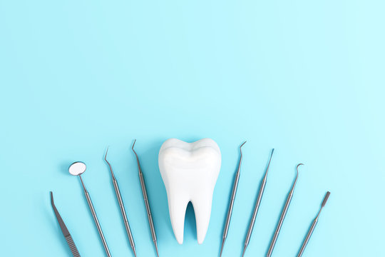 Dentist tools with teeth on pastel blue background. 3d rendering