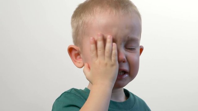 Baby (kid, child, little  boy) is crying. Tears, closeup face, portrait