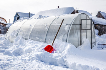 Polycarbonate greenhouse in winter. Western Siberia