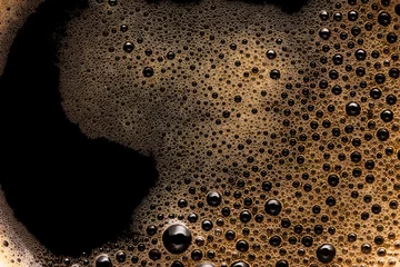 Coffee foam extreme close-up texture background © evilwata