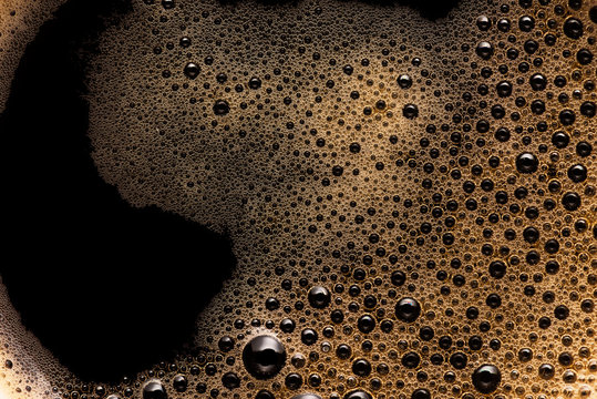 Coffee foam extreme close-up texture background