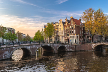 Fototapeta premium Amsterdam Netherlands, city skyline Dutch house at canal waterfront