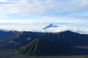 The delightful volcanic complex Bromo Tengger Semeru National Park against the background of fascinating views of nature, sky, craters and clouds