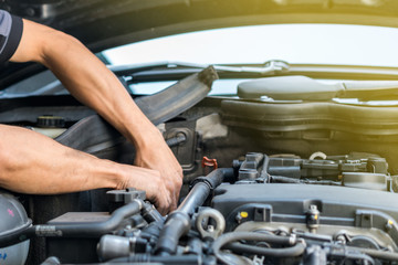 People or mechanic car repair during investigate cause of problem (mechanism check) or working on...