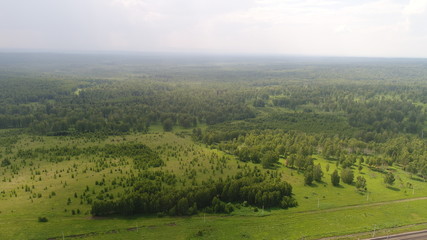 Fototapeta na wymiar panoramic picture of green valley and forest made by dron from high flight
