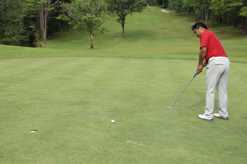 Golfers are putting golf in the evening golf course golf backglound in Thailand