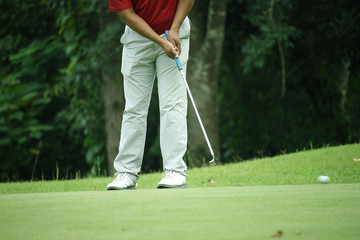 Fototapeta premium Golfers are putting golf in the evening golf course golf backglound in Thailand