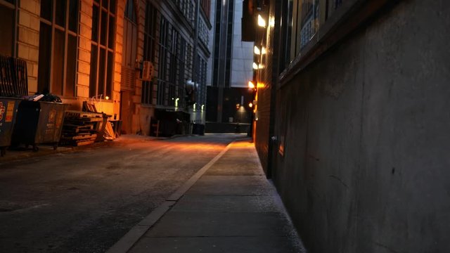 Dark scary alley in downtown area at night