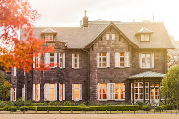 Sunset on Tokyo Metropolitan Park KyuFurukawa's old western-style mansion at red maple momiji leaves season in autumn.