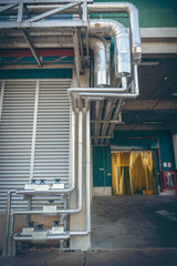 Equipment, cables and piping as found inside of industrial power plant