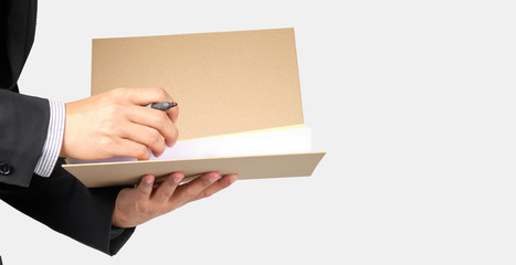 Businessman hold documents file to check on isolated background with clipping path.