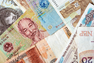 Different countries money background close up. Belarusian rubles, Georgian lari, Polish zloty, Israeli shekels, Vietnamese dongs