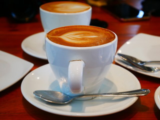 cup of coffee on wooden table