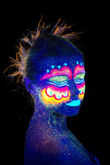 Blue woman portrait, aliens sleeps, ultraviolet make-up.  Beautiful on a dark background. Semi profileportrait