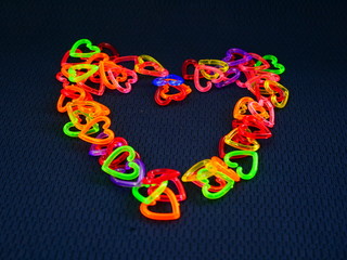 heart made of colorful beads on white background