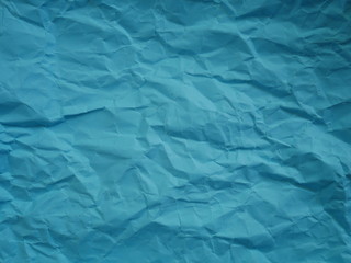 crumpled blue paper background