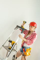 Woman with repairing tools and ladder