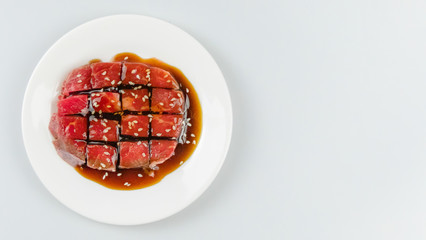 raw beef on a plate .