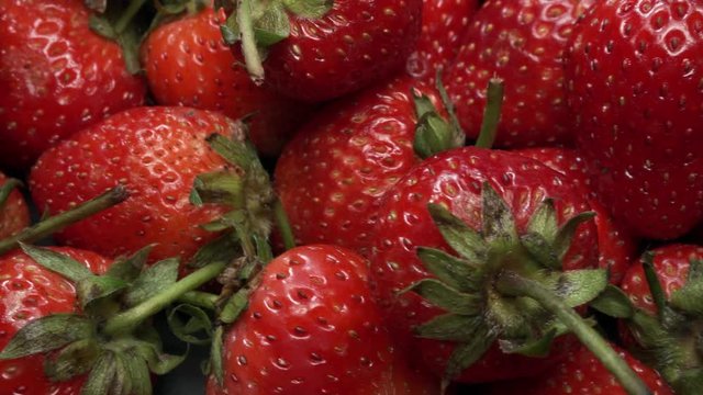 Many Fresh Raw Strawberries Rotating. Healthy Superfood