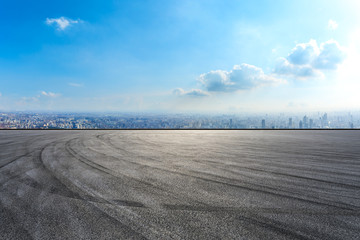 Empty asphalt road and city skyline in Shanghai,high angle view