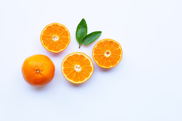 High vitamin C. Fresh orange citrus fruit with leaves isolated on white