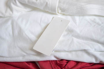 Blank price tag label on white t-shirt