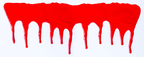 Red paint dripping on a white.