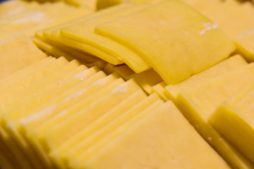Cheddar cheese slices close up. Food bacground