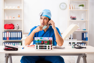 Mad doctor working in the clinic 