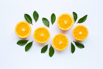 High vitamin C. Fresh orange citrus fruit with leaves isolated on white.