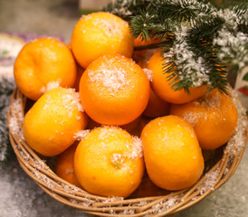 Basket with tangerines on a shop window